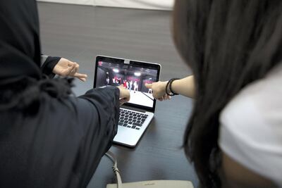 Members of the class study the music video. Karma Gurung / The National