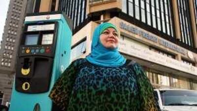 Enas Saeed, an employee of a travel agency on Hamdan Street, says she spends a lot of time every morning searching for a parking spot in the areas where fees are not yet charged.