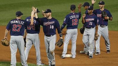 Minnesota Twins players celebrate their win over the White Sox in Chicago.