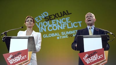 Actress and special envoy of the UN High Commissioner for Refugees (UNHCR), Angelina Jolie, and British Foreign Secretary William Hague at a global summit to end sexual violence in conflict, held in London on June 10, 2014. Carl Court/Reuters