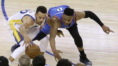 Golden State Warriors guard Stephen Curry, left, is defended by Oklahoma City Thunder guard Russell Westbrook during the second half of Game 1 of the NBA basketball Western Conference finals in Oakland, Calif., Monday, May 16, 2016. The Thunder won 108-102. (AP Photo/Jeff Chiu)