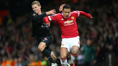 United's Memphis Depay battles withd Andre Romer of Midtjylland. Getty