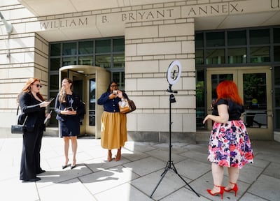 TikTok creators outisde the Washington courthouse during the hearing. TikTok made an attempt before the US District Court to convince that a law requiring the video-sharing app to divest from its Chinese ownership or face a ban in the US is unconstitutional. Reuters