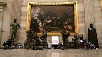 Police in riot gear sit in the rotunda of the US Capitol in Washington, DC. The House and Senate resumed a politically charged debate over the legitimacy of the presidential election hours after a pro-Trump mob stormed the Capitol and drove lawmakers from their chambers. Bloomberg