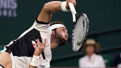 Nikoloz Basilashvili, of Georgia, serves against Cameron Norrie, of Britain. AP Photo