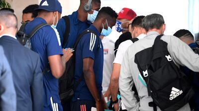 Lyon's players arrive at the team hotel in Cascais. AFP