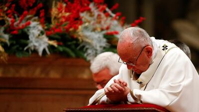 Pope Francis leads the Christmas night Mass in Saint Peter's Basilica at the Vatican on December 24, 2017. Tony Gentile / Reuters