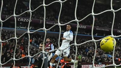 Stevenage goalkeeper Taye Ashby-Hammond watches the shot from Villa's Morgan Sanson hit the back of the net. AFP