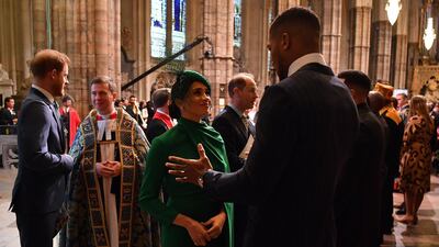 Meghan, Duchess of Sussex talks with British boxer Anthony Joshua as she leaves after attending the Commonwealth Day Service. Getty Images