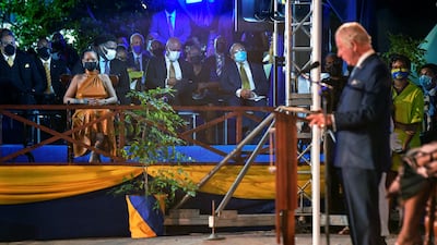 Singer Rihanna looks on as Britain's Prince Charles speaks. Reuters