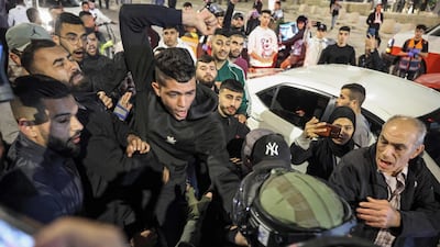 Israeli troops scuffle with Palestinians during clashes near the Damascus Gate of the Old City of Jerusalem. AFP