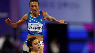 Ambra Sabatini of Italy falls during the Women's 100 metres T63 Final at the Paris 2024 Paralympics, at Stade de France, Saint-Denis. Reuters