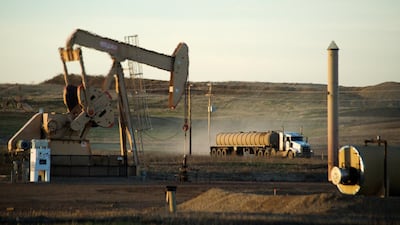 An oil well on the Fort Berthold Indian Reservation in North Dakota. Oil Futures in New York rose 0.4 per cent on Friday, paring the weekly loss to about 3.6 per cent. Andrew Cullen / Reuters.
