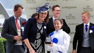 Jockey Hayley Turner poses with her award after winning the Sandringham Stakes on Thanks Be during day four of Royal Ascot at Ascot Racecourse. Press Association