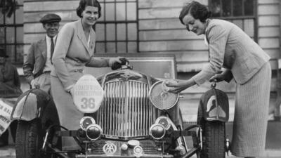 Two women polish their Aston Martin sports car at the Welsh Motor Rally in Cardiff, 1935. All photos: Getty Images