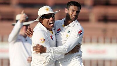 Pakistan captain Misbah-ul-Haq, left, tried to usher the retiring Shoaib Malik to lead their team off following their series clinching win in Sharjah. But is Misbah going, too? Kamran Jebreili / AP Photo