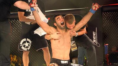 Ali Ahli celebrates after winning his fight against Luciano Ferreira at the Abu Dhabi Fight Club. October 22, 2010. Sammy Dallal / The National