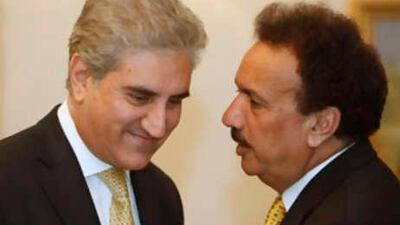 Pakistan's interior adviser Rehman Malik, right, and the foreign minister Shah Mehmood Qureshi attend a meeting of the national security conference in Islamabad on Dec 2 2008.
