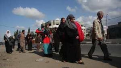 The al Bana family flee the Jabalya area of Gaza City after their house was destroyed.