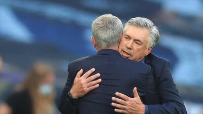 Everton manager Carlo Ancelotti hugs his Spurs counterpart Jose Mourinho after the match. Reuters