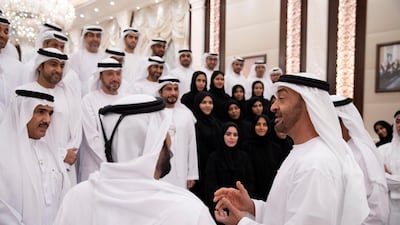 Sheikh Mohamed bin Zayed (right), receives members of Ministry of Presidential Affairs, during an iftar reception at Abu Dhabi's Al Bateen Palace. Seen with Ahmed Juma Al Zaabi, UAE Deputy Minister of Presidential Affairs (left).
