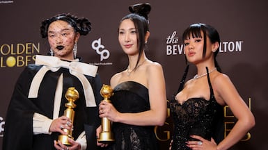 From left: Audrey Nuna, Ejae and Rei Ami pose with the Best Original Song - Motion Picture award for Golden from KPop Demon Hunters. Reuters