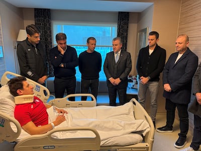 Turkey's Minister of Youth and Sports Osman Askin Bak visits referee Halil Umut Meler at a hospital in Ankara. Reuters