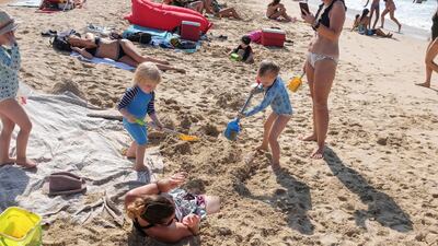 Youngsters were in playful mood at Kite Beach as the working week was delayed for a day. Antonie Robertson/The National
