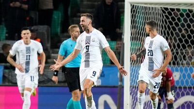 Andraz Sporar celebrates scoring Slovenia's first goal against Norway. AP