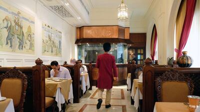 Diners enjoy a meal at India Palace restaurant in Abu Dhabi. The restaurant is among a host of family-run, traditional or long-standing restaurants in Abu Dhabi that now must compete with new fancy places in the changing F&B market in Abu Dhabi. Delores Johnson / The National / April 4, 2017