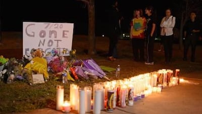 A makeshift memorial for victims of the Century 16 movie theatre where a gunman police have identified as 24-year-old James Holmes attacked movie goers during an early morning screening of the new Batman movie The Dark Knight Rises on Friday in Aurora. Kevork Djansezian / Getty Images / AFP