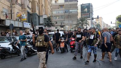 Hezbollah supporters attend the funeral of members killed during clashes in the Tayouneh neighbourhood of Beirut. AFP