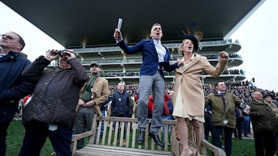 Racegoers enjoy the action. PA