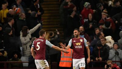 Aston Villa's Ahmed Elmohamady, right, celebrates with James Chester after Liverpool's Morgan Boyes scores an own goal. AP