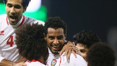 The UAE's Mohammed Ahmed celebrates with teammates after scoring the third goal in their opening Gulf Cup of Nations match.