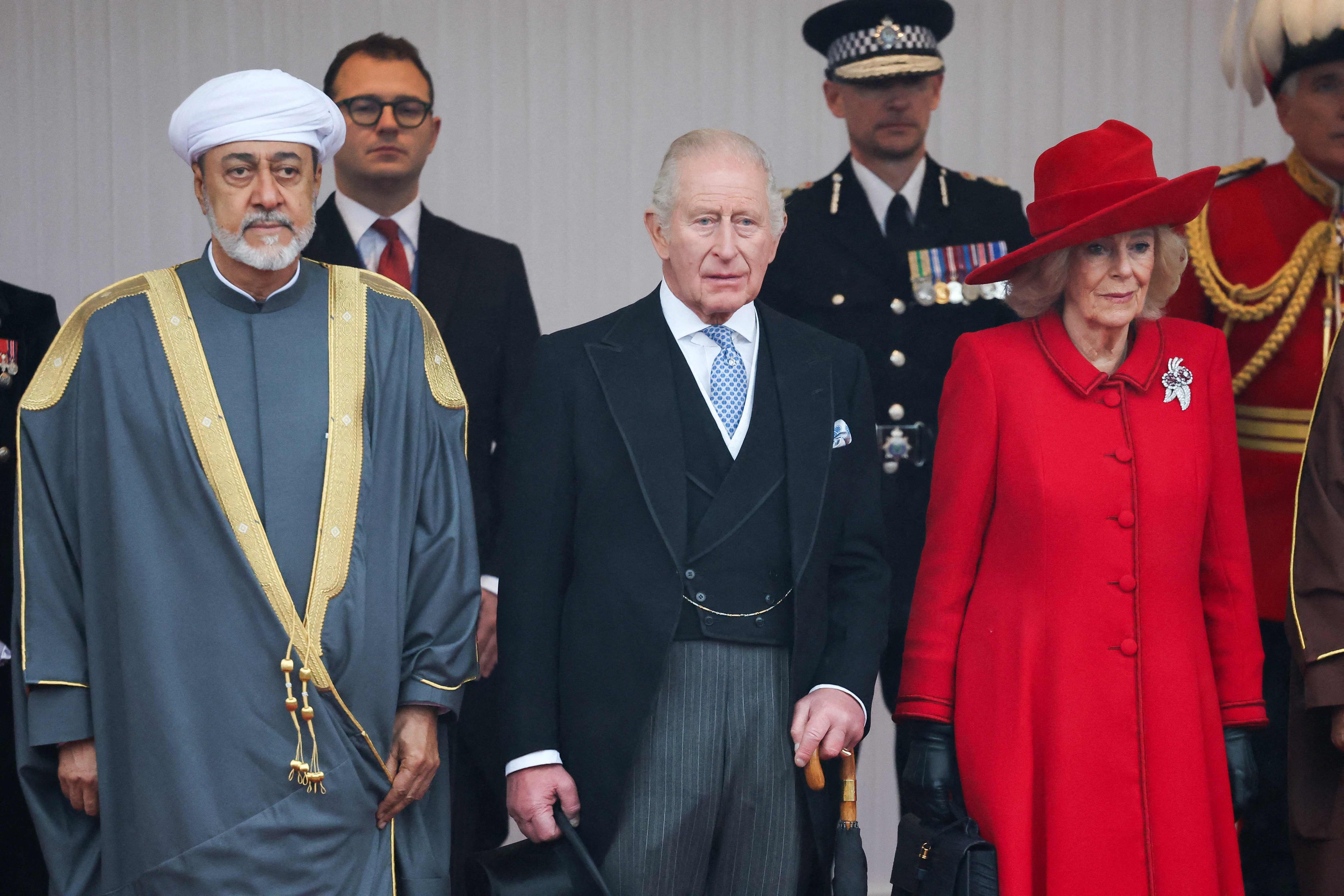 Sultan Haitham of Oman, Britain's King Charles III and Queen Camilla stand at The Royal Dias in Windsor, during the Sultan's state visit. AFP