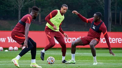 Divock Origi, Joel Matip and Ibrahima Konate of Liverpool during a training session at AXA Training Centre.