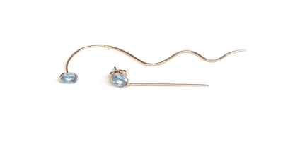 Needle and thread topaz earrings; Dh2,340