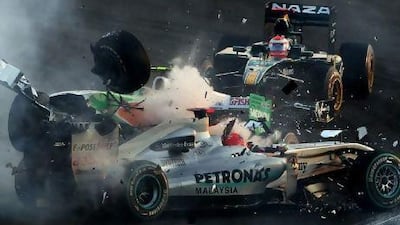 Vitantonio Liuzzi, the Force India driver, crashes into Michael Schumacher, the seven-time champion, at the start of yesterday’s race.