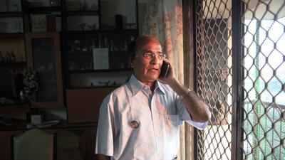 Dr Pramod Potdar calls his lawyer regarding the legal options to prevent the demolition of his apartment at the Campa Cola compound. Subhash Sharma for The National