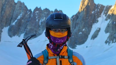 Zabih Afzali holding a pick axe on Mount Shah Fuladi in Bamiyan, June 2020. Courtesy Zabih Afzali