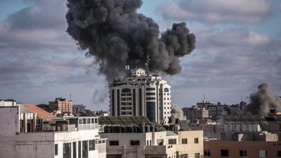 Smoke rises following an Israeli air strike on a building on May 17, in Gaza City. More than 200 people in Gaza and ten people in Israel have been killed. Getty