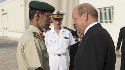 The French defence minister Jean-Yves Le Drian, right, with the Chief of Staff of the UAE Armed Forces, Lt Gen Hamad Mohammed Thani Al Rumaithi, in Abu Dhabi. French planes carried out their first reconnaissance flights over Iraq in support of the US-led campaign against ISIL. AFP