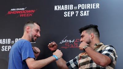 Fan Trevor Friesen, left, squares up to fighter Kelvin Gastelum at the UFC fan zone. Yas Island, Abu Dhabi. Chris Whiteoak / The National