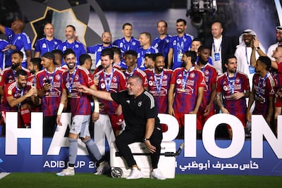 Sharjah manager Cosmin Olaroiu, centre, has won four domestic trophies since taking charge of the club 18 months ago. Getty