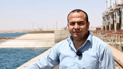 Welat Derwish, the regional director of water administration in the Syrian democratic forces, stand on Tapqa dam where his office located. Photo by Daham Alasaad