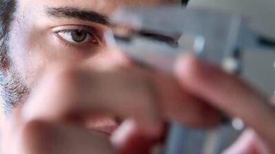 Rodrigo Ceballos, 19, calibrates an instrument. Delores Johnson / The National