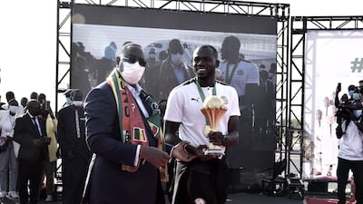 Senegal President Macky Sall, left, with Senegal captain Kalidou Koubaly in Dakar. AFP
