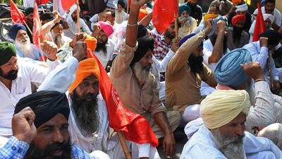Farmers shout slogans during a protest in Amritsar on October 2. Photo: AFP