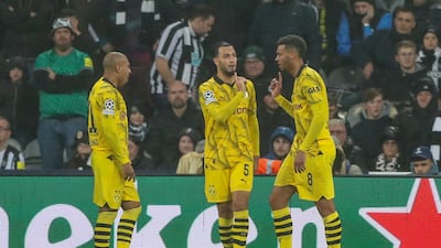 Dortmund's Felix Nmecha, right, celebrates with teammates after scoring. AP